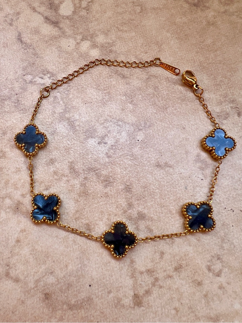 Stainless Steel Gold Clover Link Bracelet with Dark Gray Mother-of-Pearl Accents